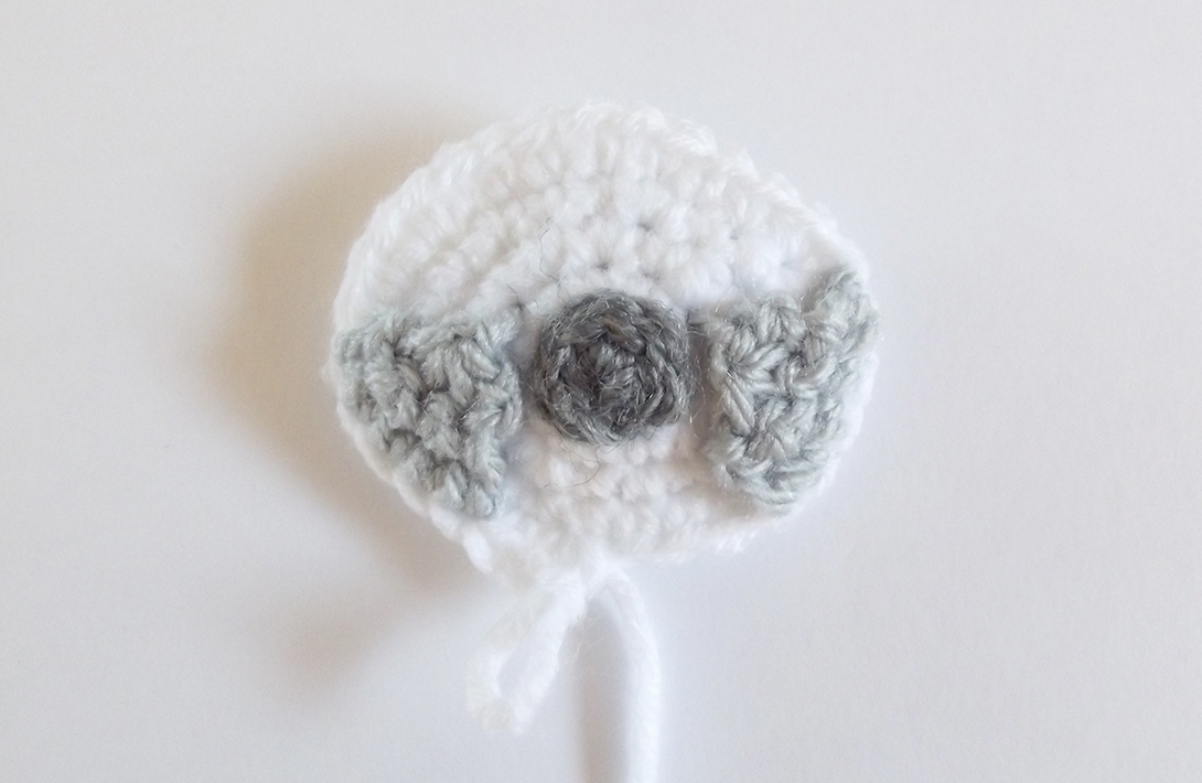 How to crochet around any teething ring for a baby. Free crochet pattern, with a cute sloth face!