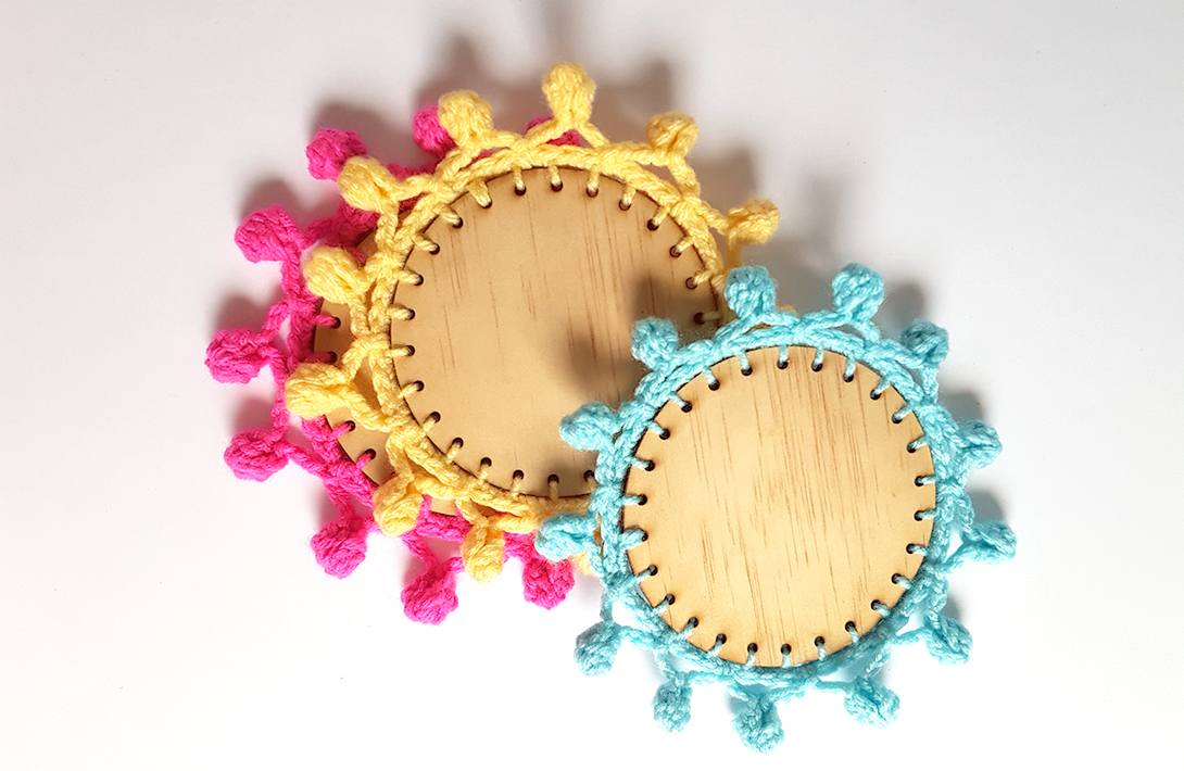 Crochet trim on wooden laser cut coasters. Tutorial with free laser cutting file.