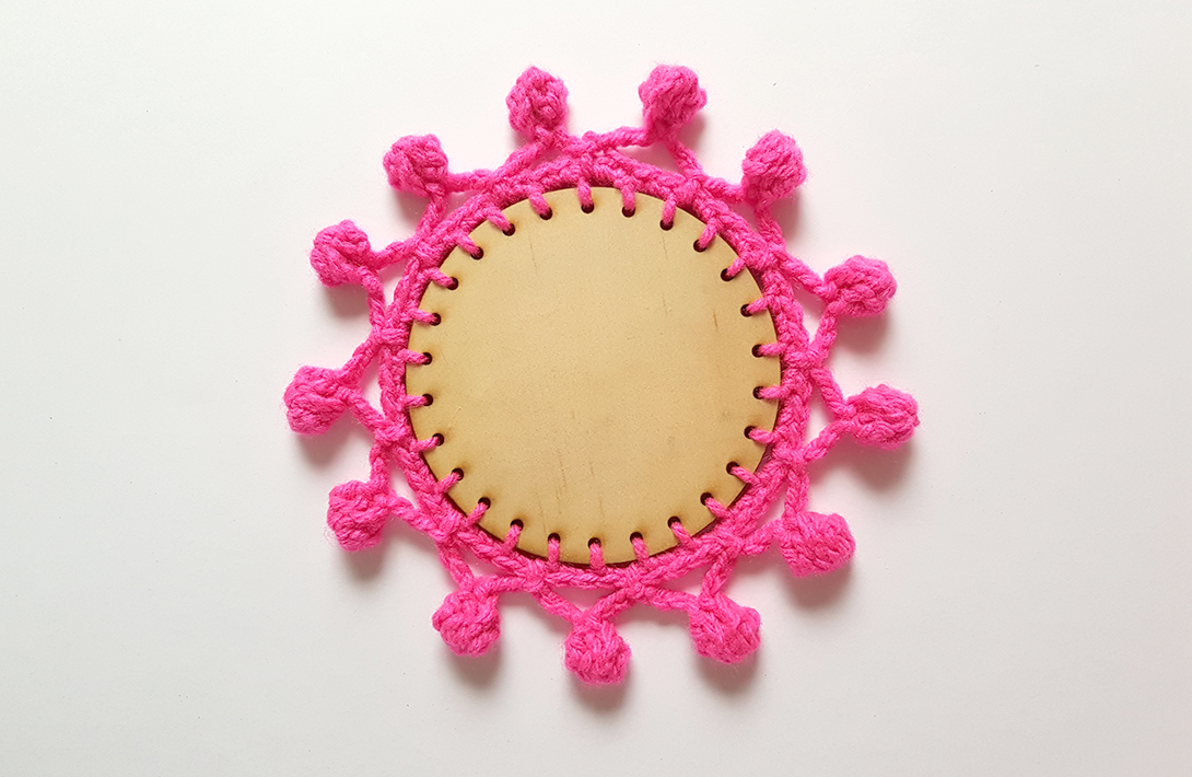 Crochet trim on wooden laser cut coasters. Tutorial with free laser cutting file.